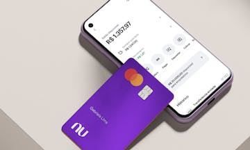 Nubank credit card propped by cell phone